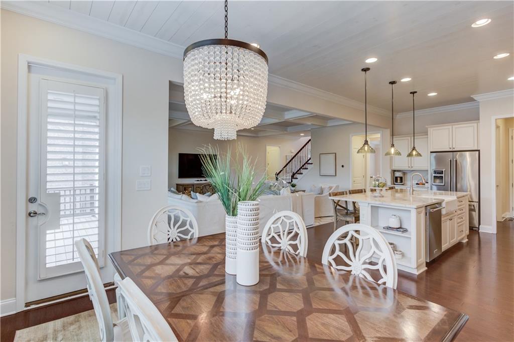 632 Rio Vista Court Suwanee, GA 30024 - Photo 22 of 64 a view of a kitchen with furniture a kitchen and chandelier