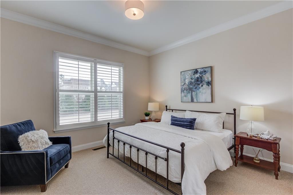 632 Rio Vista Court Suwanee, GA 30024 - Photo 25 of 64 a bedroom with a bed a couch and a window