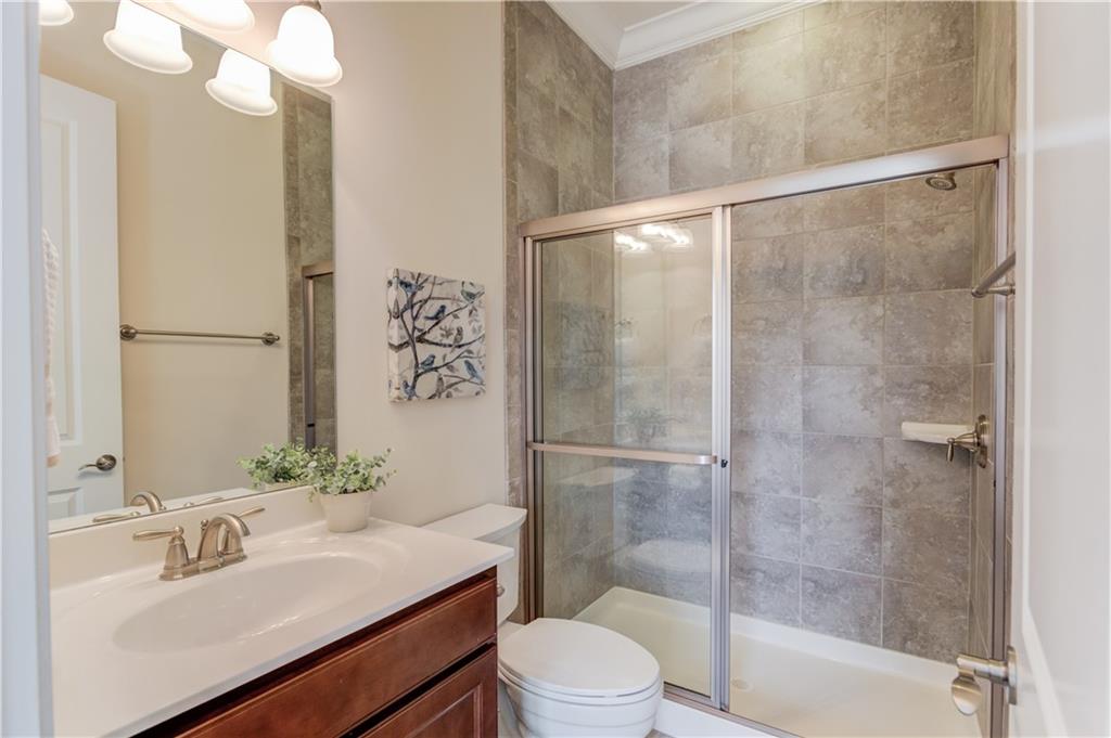 632 Rio Vista Court Suwanee, GA 30024 - Photo 26 of 64 a bathroom with a sink toilet and shower