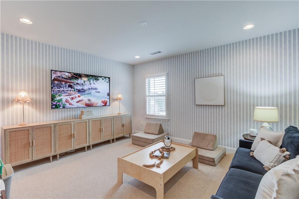 632 Rio Vista Court Suwanee, GA 30024 - Photo 31 of 64 a living room with furniture a rug and a window