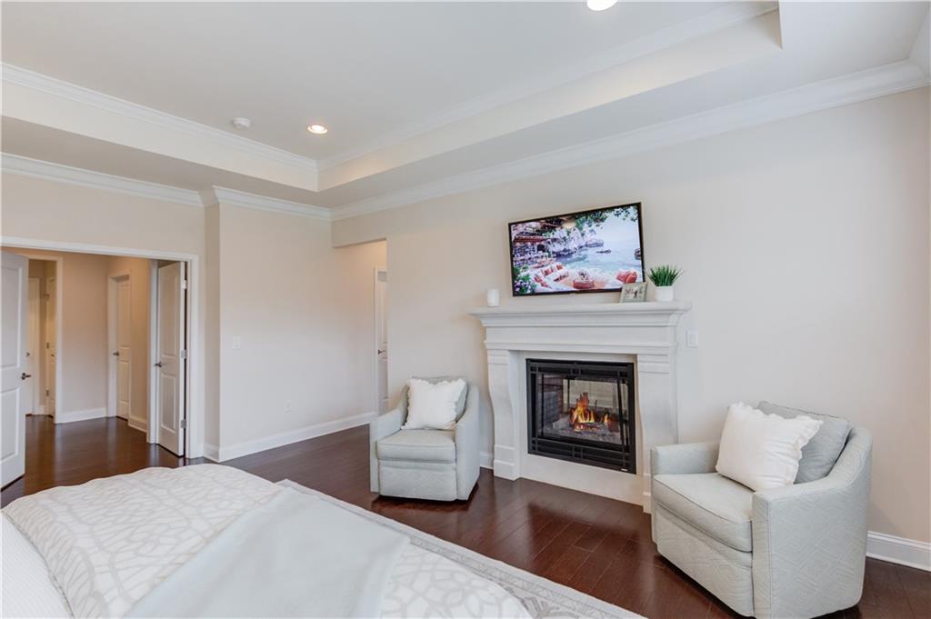 632 Rio Vista Court Suwanee, GA 30024 - Photo 34 of 64 a living room with furniture and a fireplace