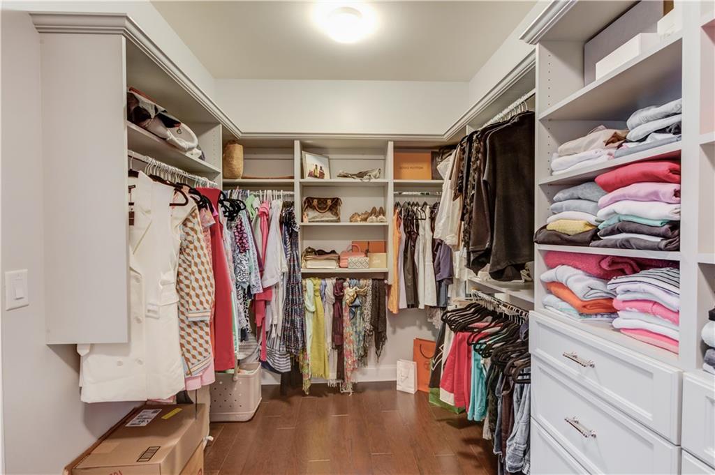 632 Rio Vista Court Suwanee, GA 30024 - Photo 38 of 64 a view of walk in closet with clothes