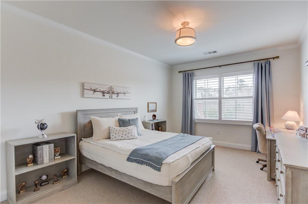 632 Rio Vista Court Suwanee, GA 30024 - Photo 41 of 64 a bedroom with a bed and a window