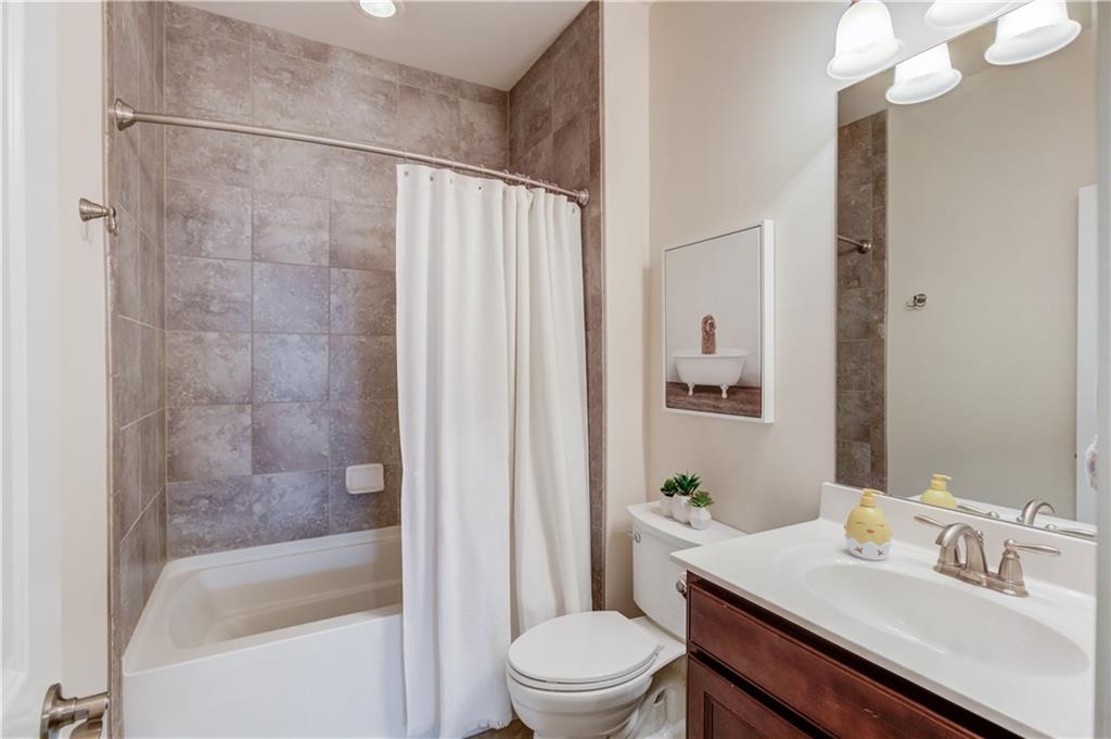 632 Rio Vista Court Suwanee, GA 30024 - Photo 43 of 64 a bathroom with a sink toilet and shower