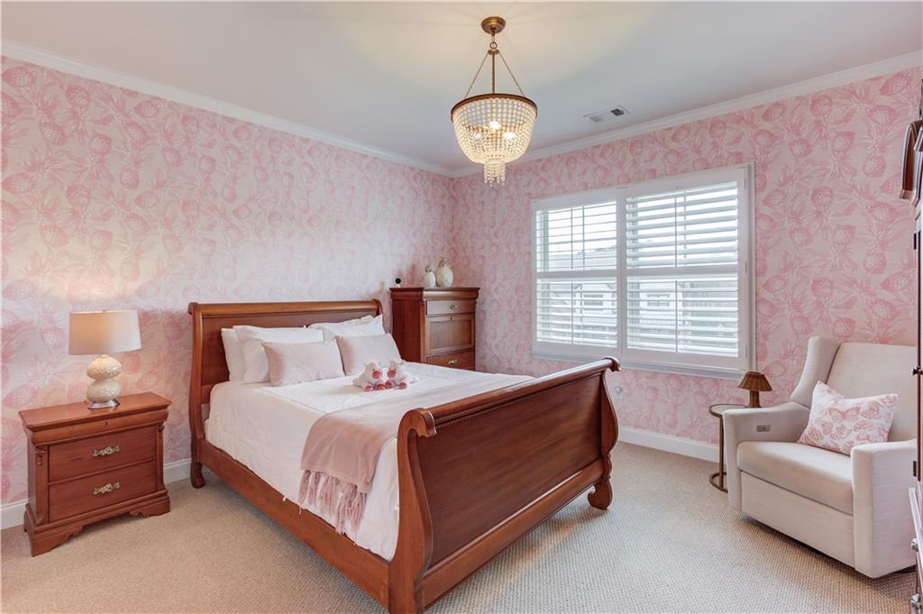 632 Rio Vista Court Suwanee, GA 30024 - Photo 48 of 64 a bedroom with a bed and a couch