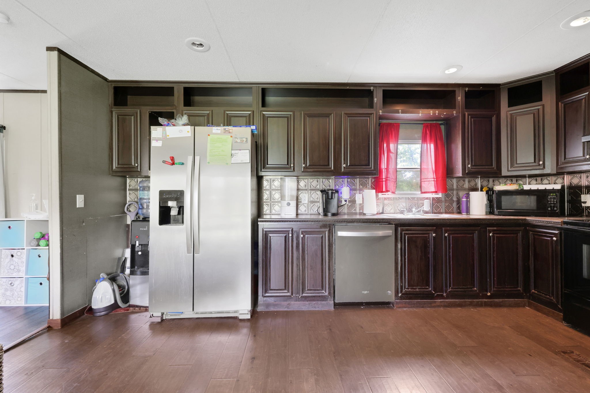 103 Sunset Lane Somerville, TX 77879 - Photo 13 of 43 a kitchen with granite countertop a refrigerator and a sink