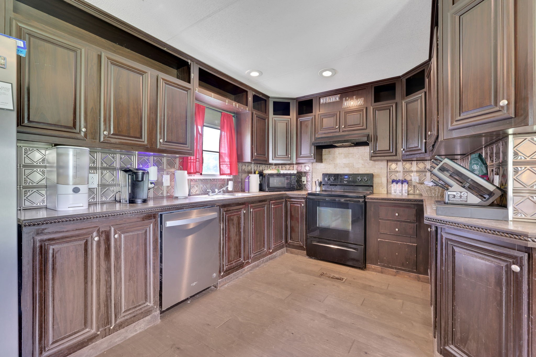 103 Sunset Lane Somerville, TX 77879 - Photo 15 of 43 a kitchen with granite countertop a refrigerator stove top oven and sink