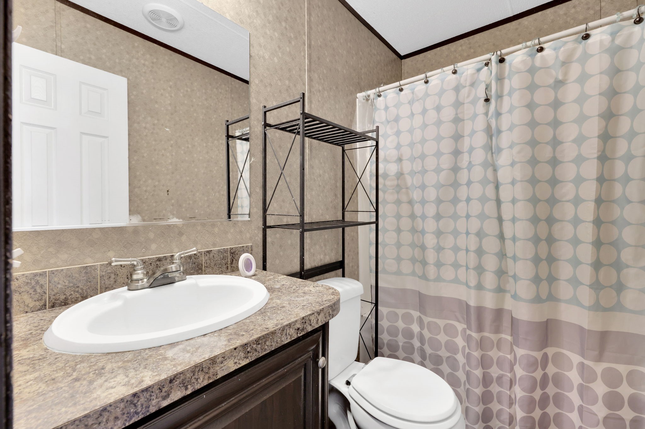 103 Sunset Lane Somerville, TX 77879 - Photo 19 of 43 a bathroom with a granite countertop sink toilet and shower