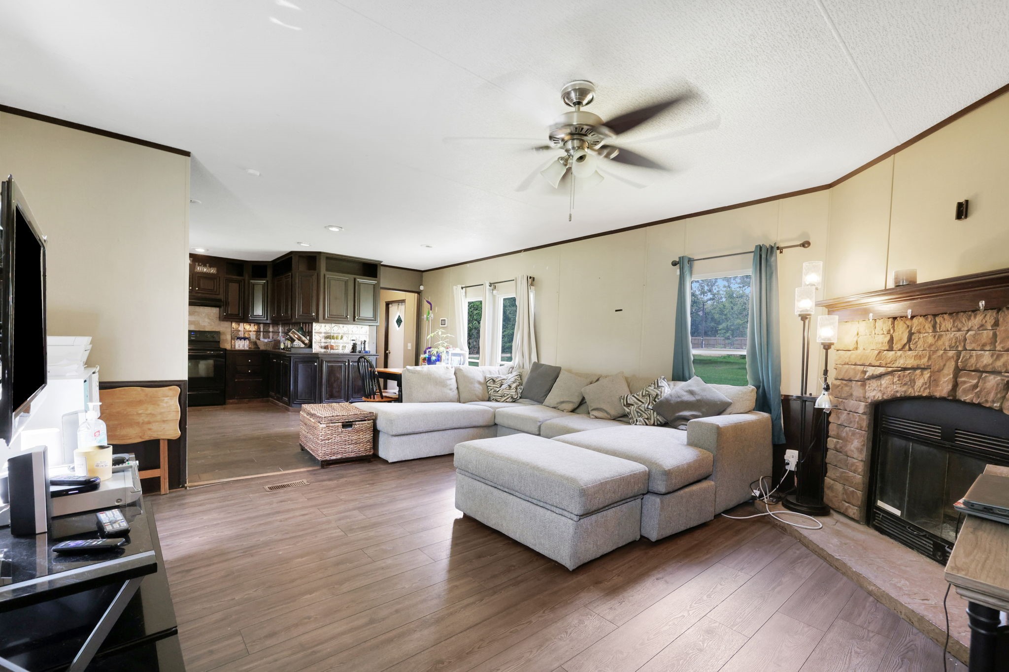 103 Sunset Lane Somerville, TX 77879 - Photo 2 of 42 a living room with furniture and a fireplace