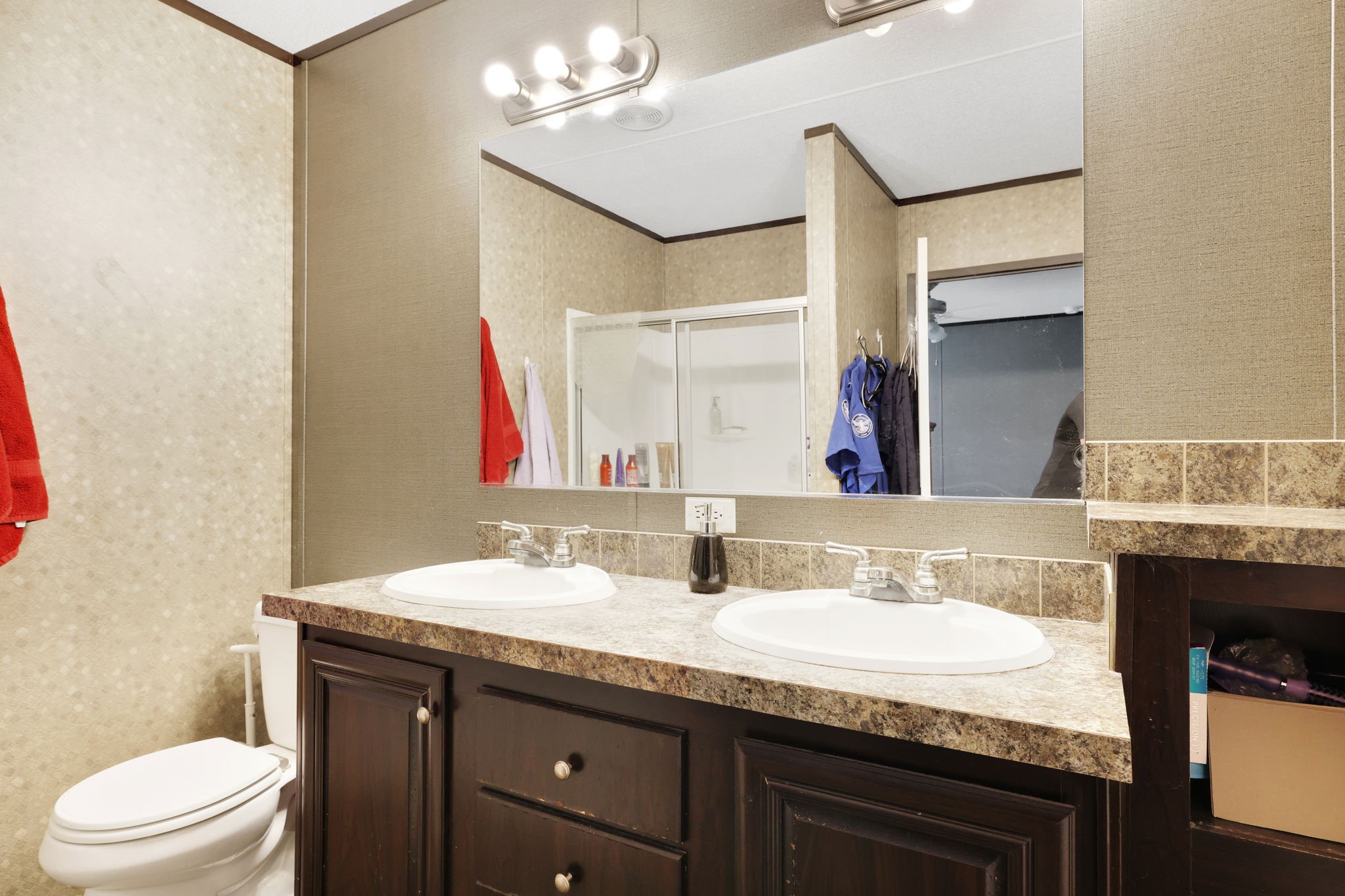 103 Sunset Lane Somerville, TX 77879 - Photo 24 of 43 a bathroom with a granite countertop sink a toilet and a mirror