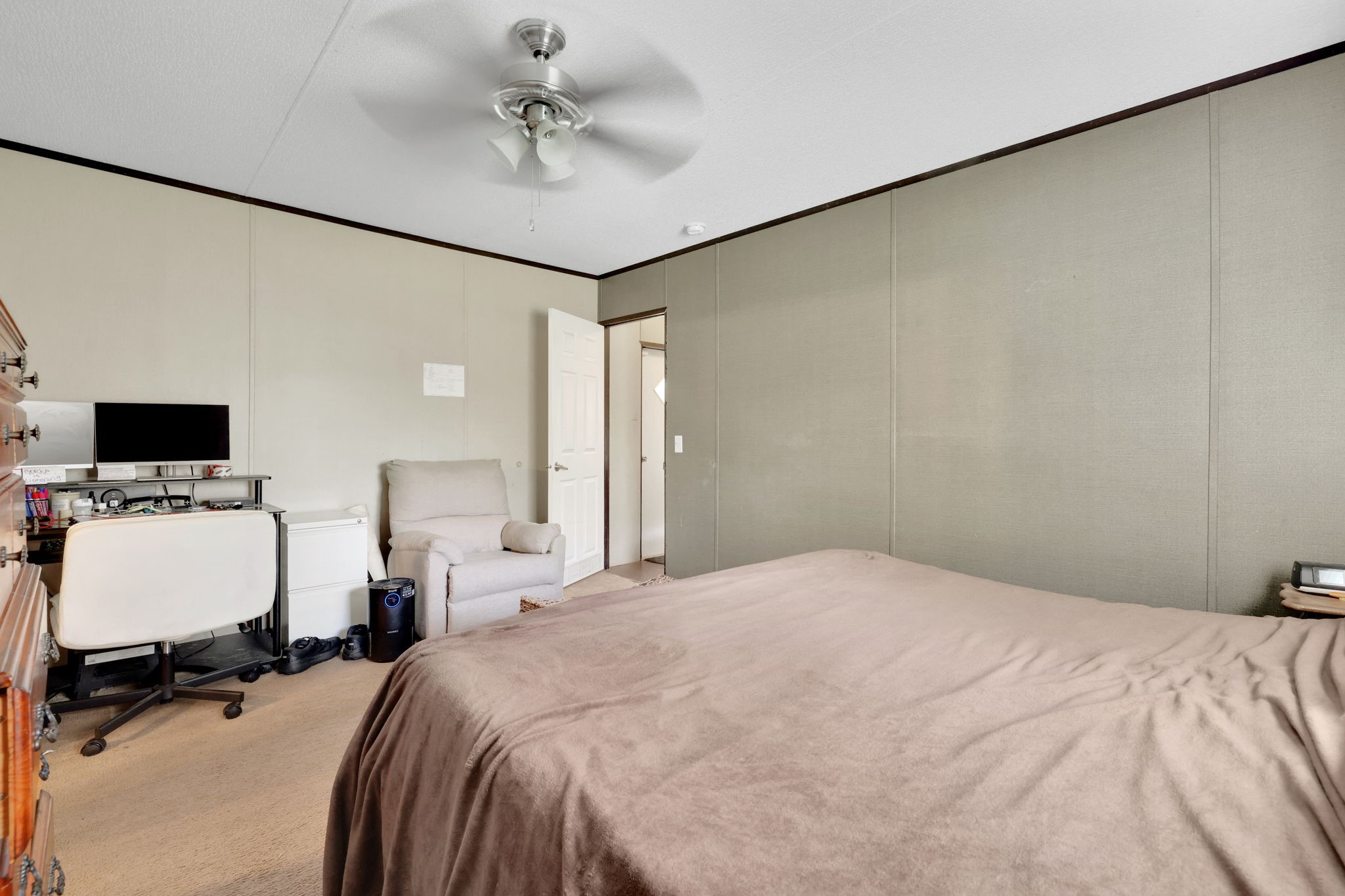 103 Sunset Lane Somerville, TX 77879 - Photo 25 of 43 a bedroom with a bed and a flat screen tv