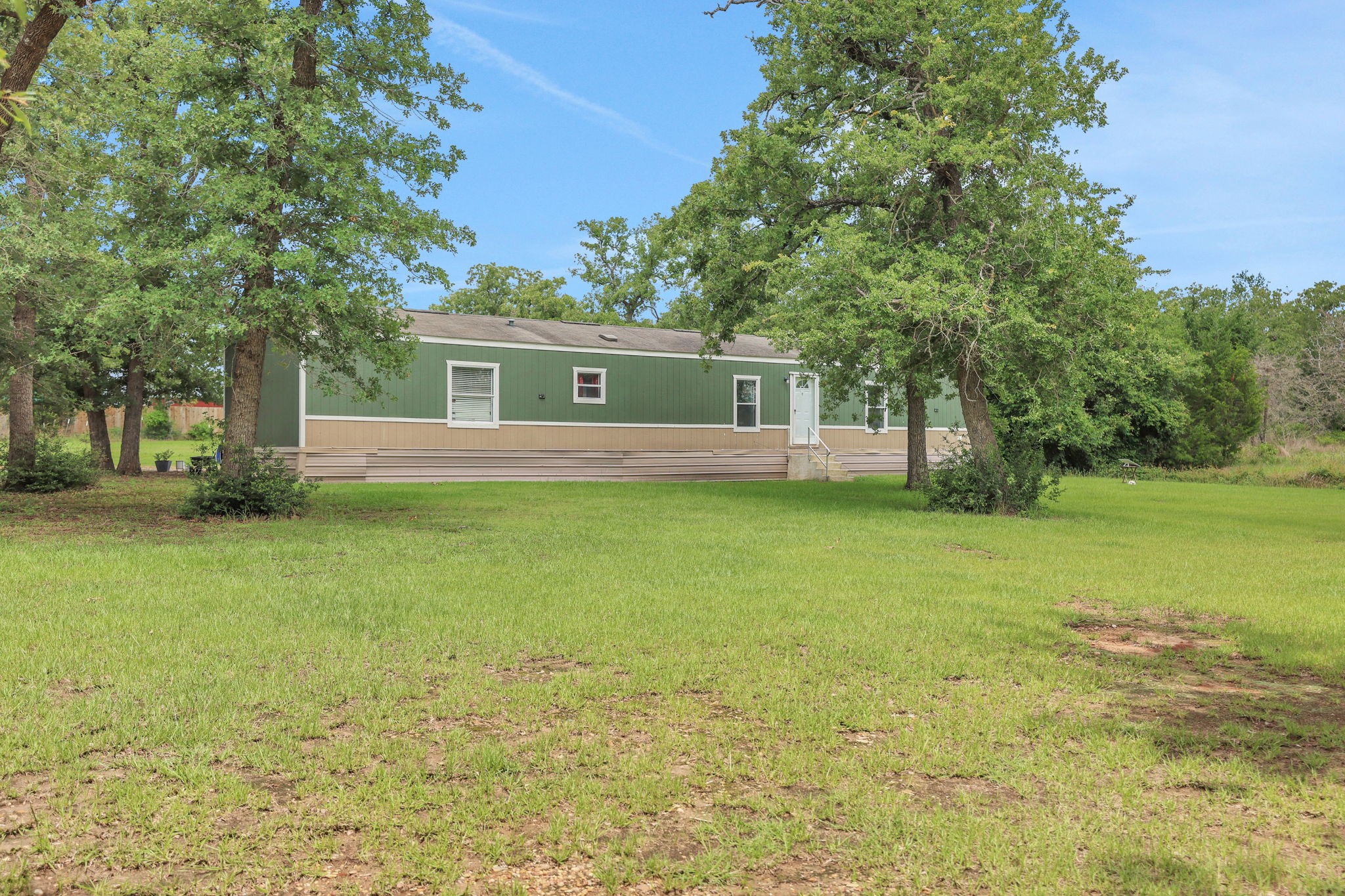 103 Sunset Lane Somerville, TX 77879 - Photo 3 of 43 a house view with swimming pool in front of it