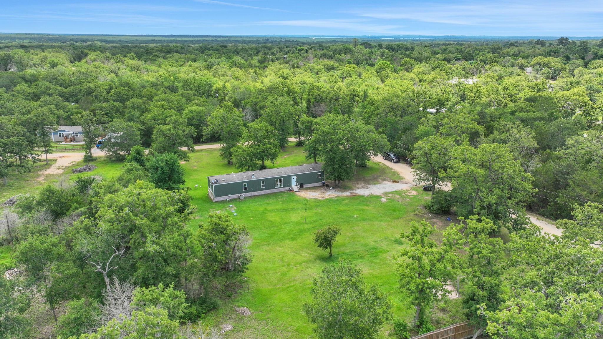 103 Sunset Lane Somerville, TX 77879 - Photo 32 of 43 a view of a lush green forest