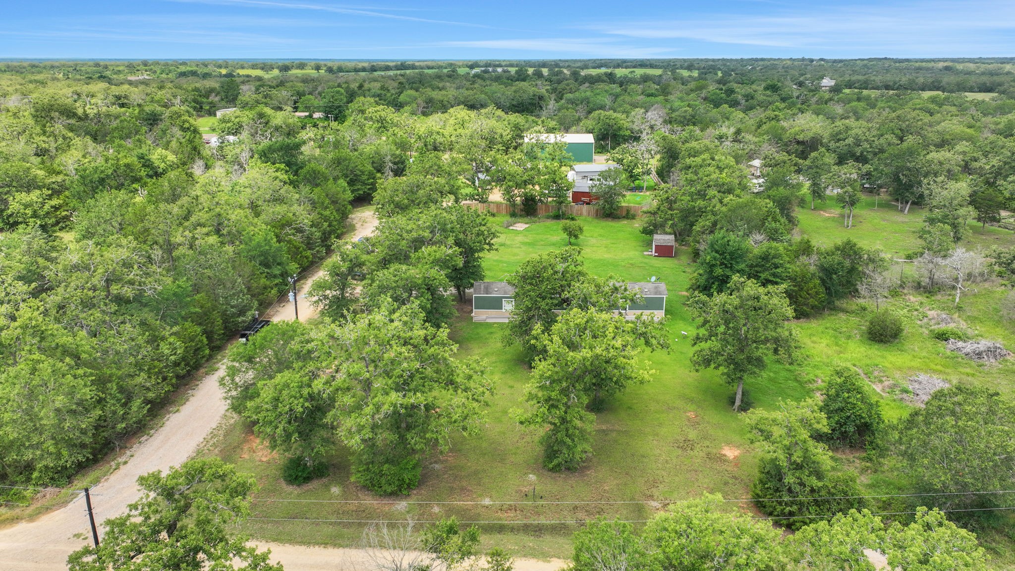 103 Sunset Lane Somerville, TX 77879 - Photo 35 of 43 a view of a green field with lots of trees