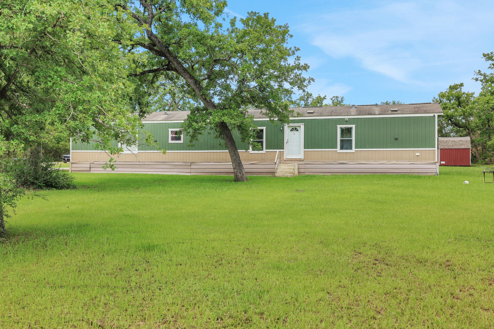 103 Sunset Lane Somerville, TX 77879 - Photo 4 of 43 a view of a house with a yard porch and sitting area
