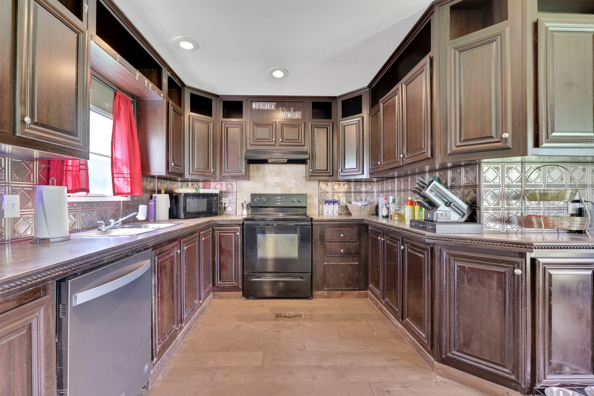 103 Sunset Lane Somerville, TX 77879 - Photo 5 of 42 a kitchen with stainless steel appliances granite countertop a sink and cabinets