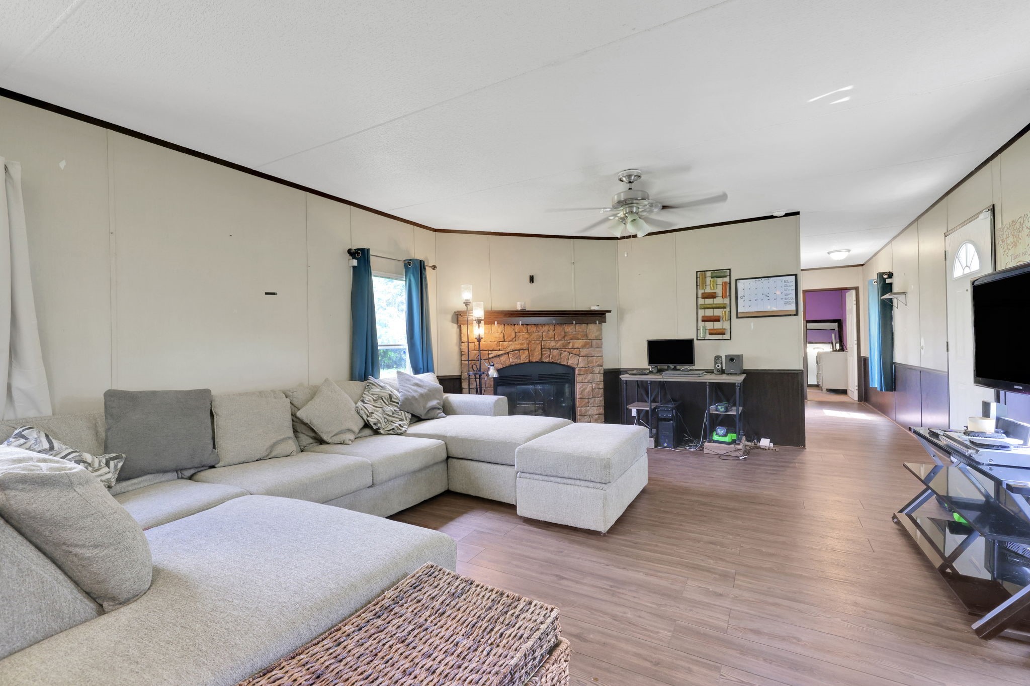 103 Sunset Lane Somerville, TX 77879 - Photo 7 of 43 a living room with fireplace furniture and a flat screen tv