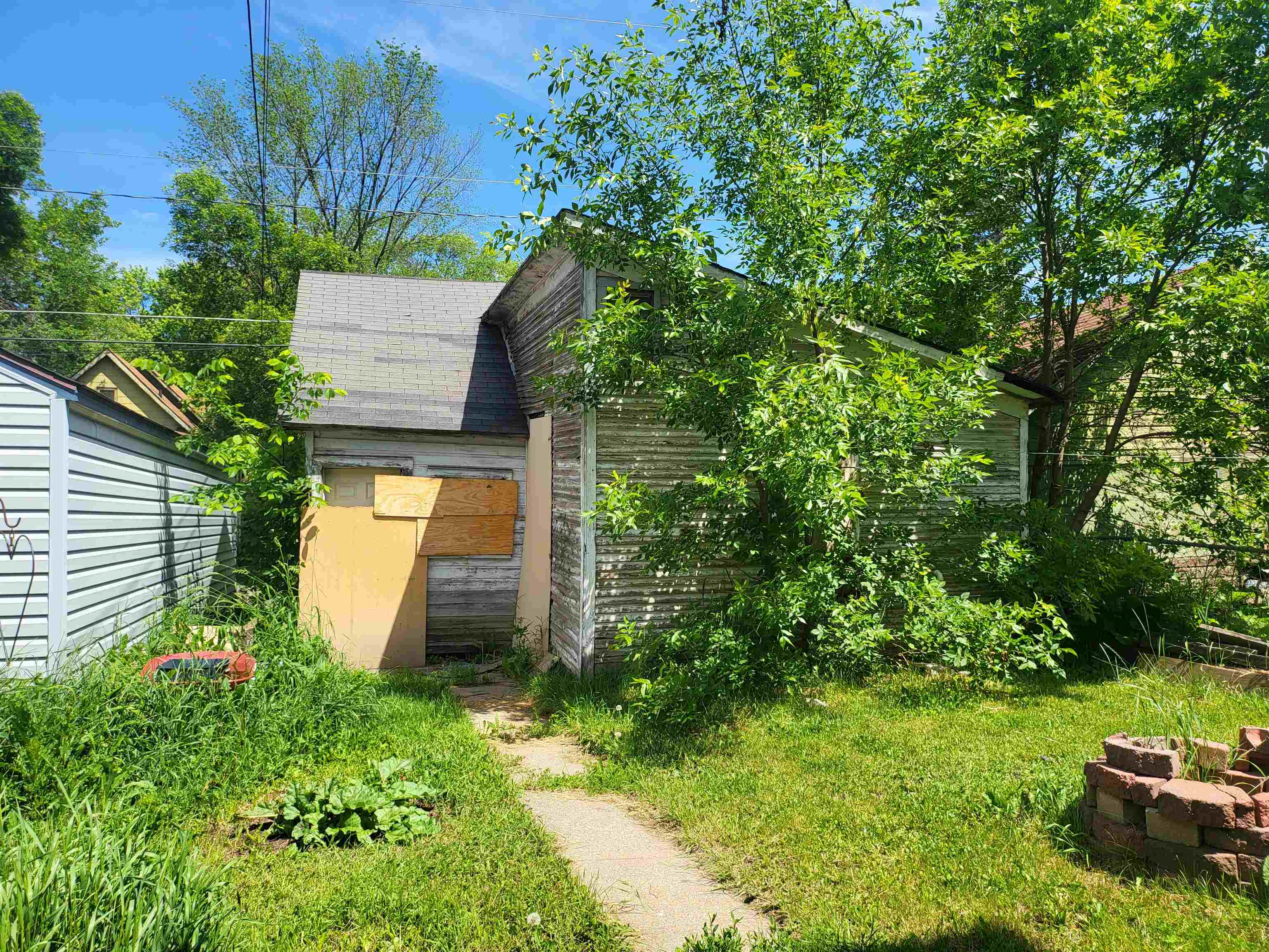 119 8th Street South Virginia, MN 55792 - Photo 16 of 18 View of home's exterior featuring a fire pit