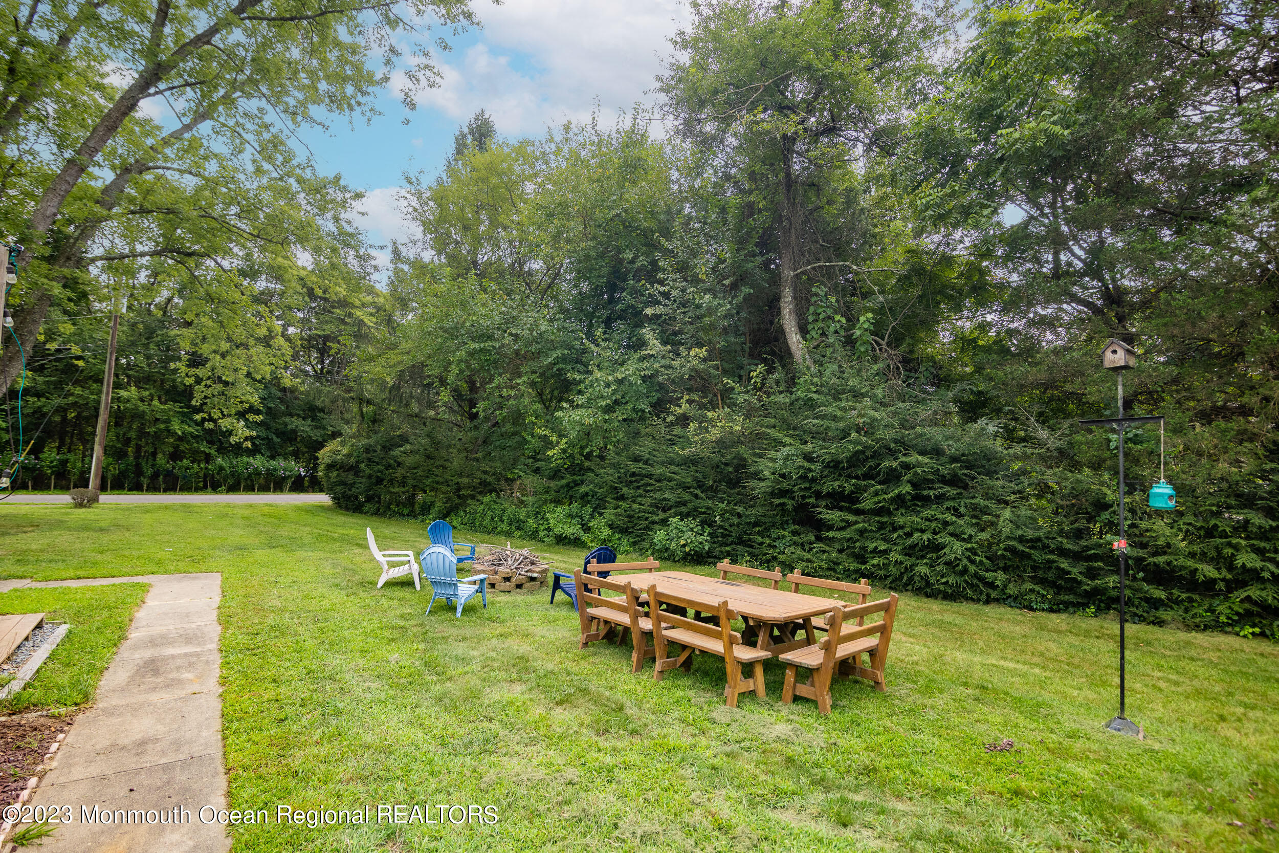 839 Hulses Corner Road Howell, NJ 07731 - Photo 10 of 37 a backyard of a house with table and chairs