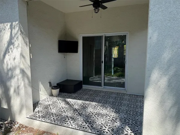 a view of a house with a yard and tree s