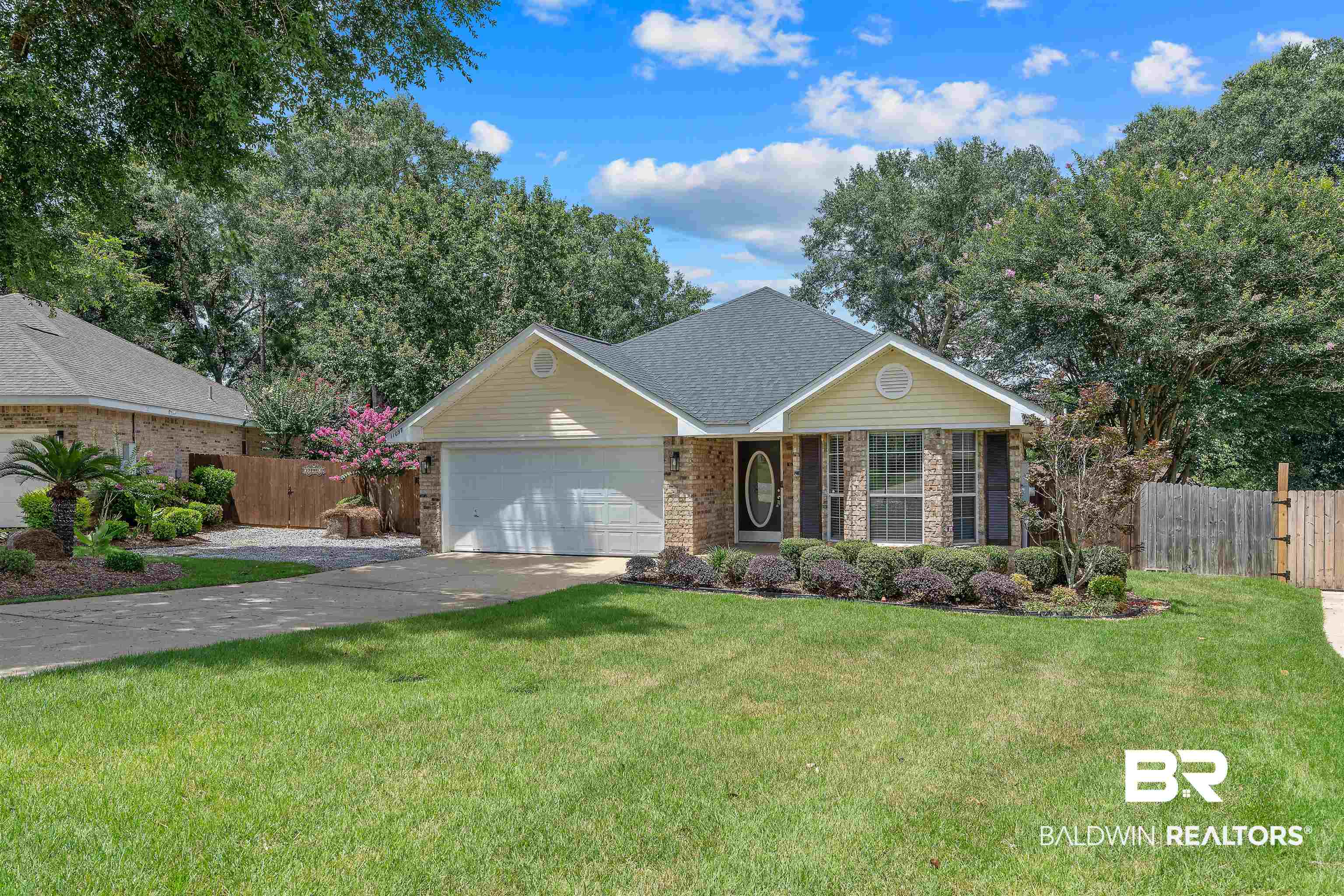11097 Pontchartrain Loop Daphne, AL 36526 - Photo 2 of 28 View of front facade with a garage, driveway, and brick siding