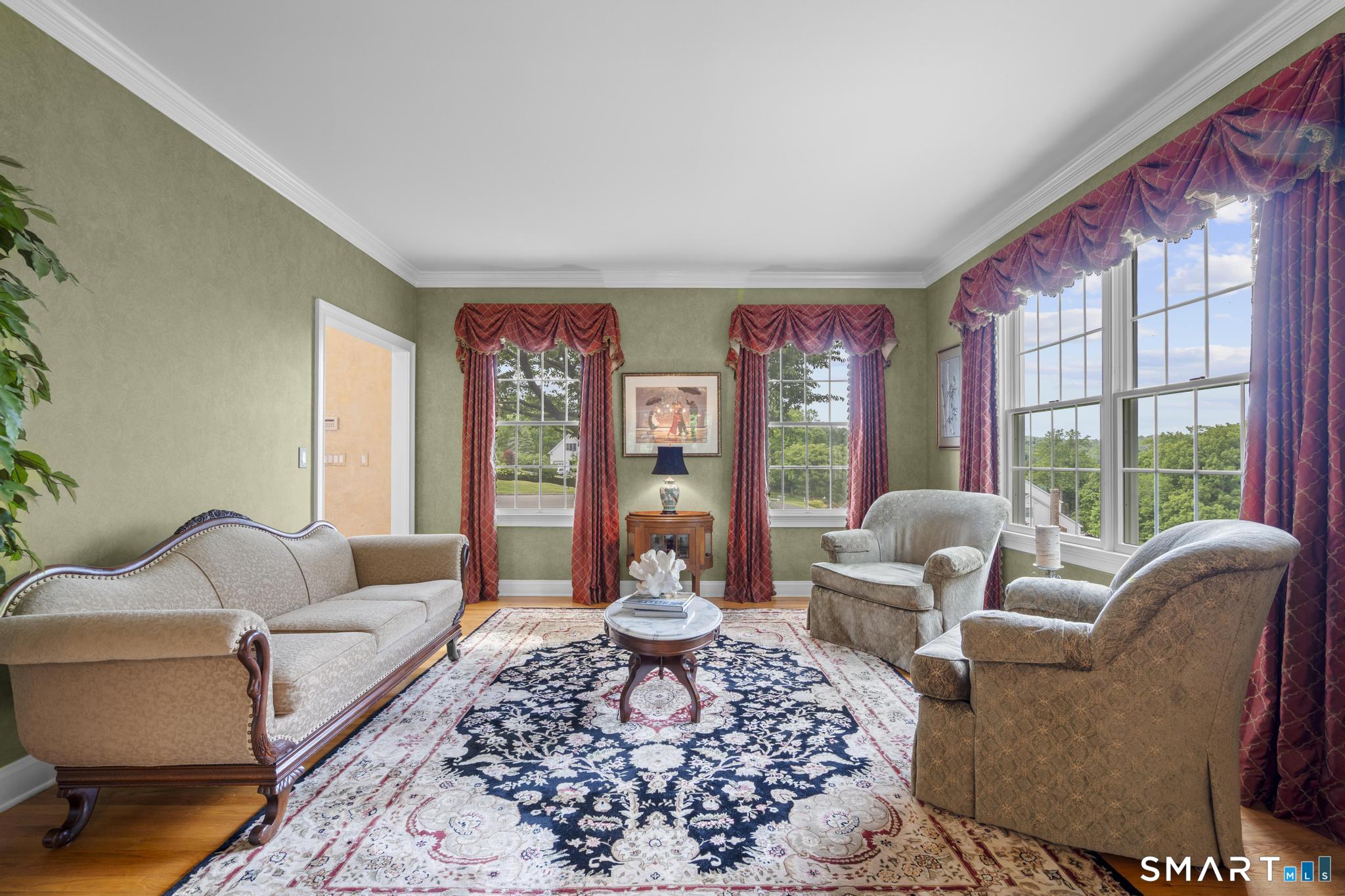 12 Logans Way Danbury, CT 06811 - Photo 14 of 40 a living room with furniture and a large window