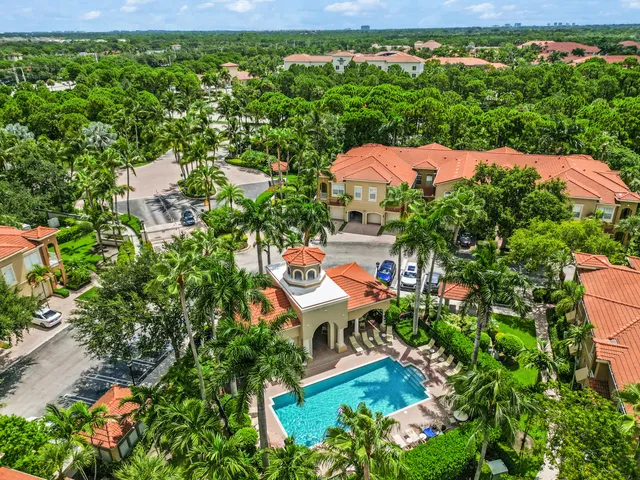 an aerial view of a house with garden space and street view