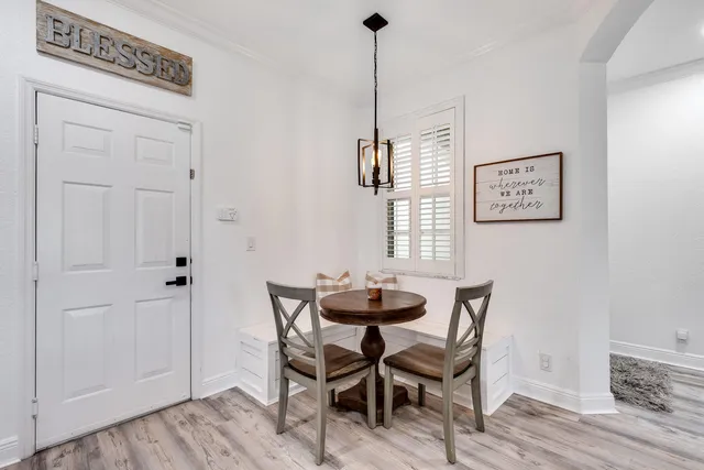 a dining room with furniture and window