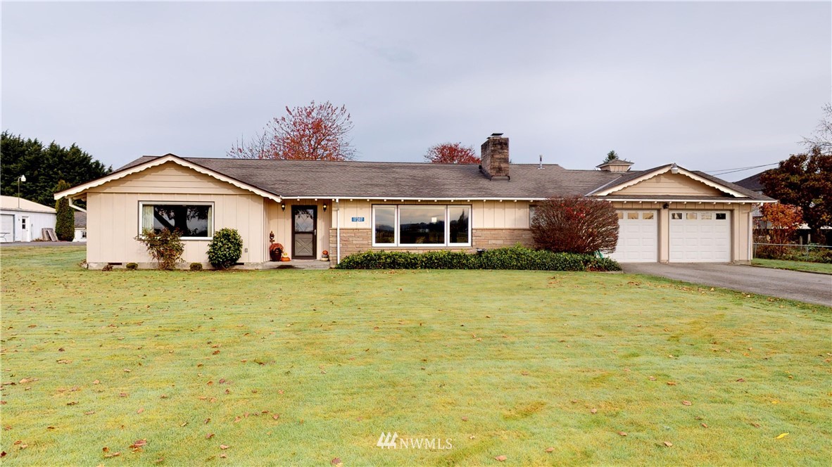 17307 Dunbar Road Mount Vernon, WA 98273 - Photo 1 of 22 a front view of a house with a yard