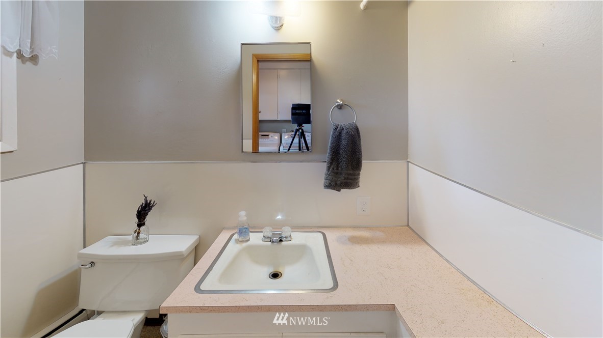17307 Dunbar Road Mount Vernon, WA 98273 - Photo 17 of 22 a bathroom with a sink and mirror