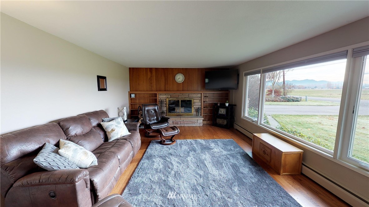 17307 Dunbar Road Mount Vernon, WA 98273 - Photo 3 of 22 a living room with furniture and a large window