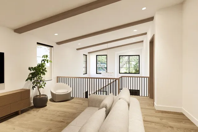 a view of a living room and wooden floor