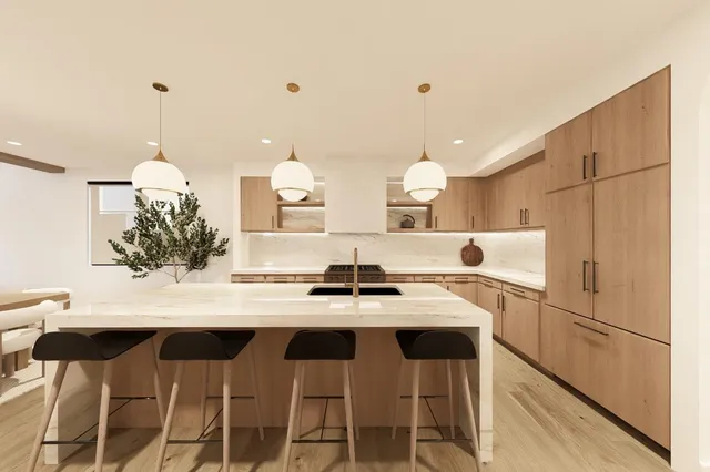 a kitchen with a dining table chairs and refrigerator