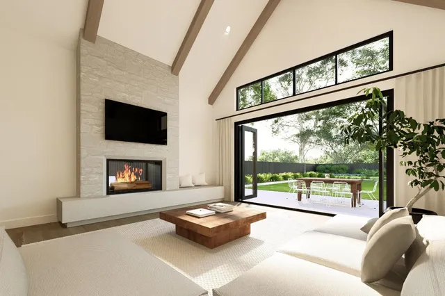 a living room with fireplace furniture and a flat screen tv
