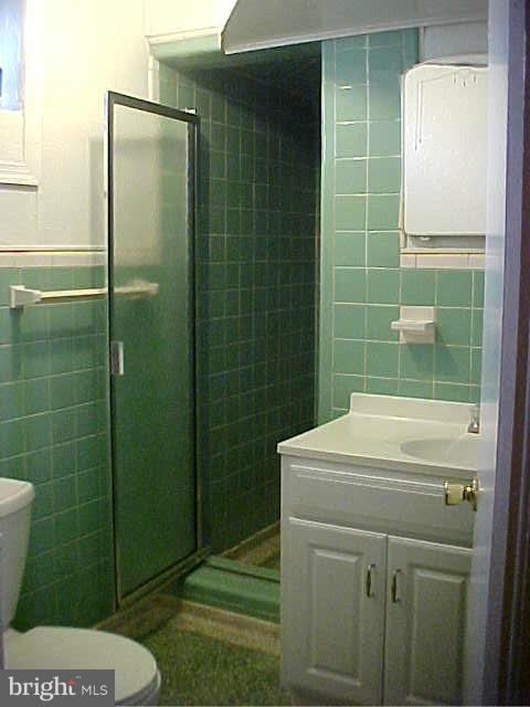 3617 Randolph Road Silver Spring, MD 20902 - Photo 14 of 16 a bathroom with a toilet a sink and shower