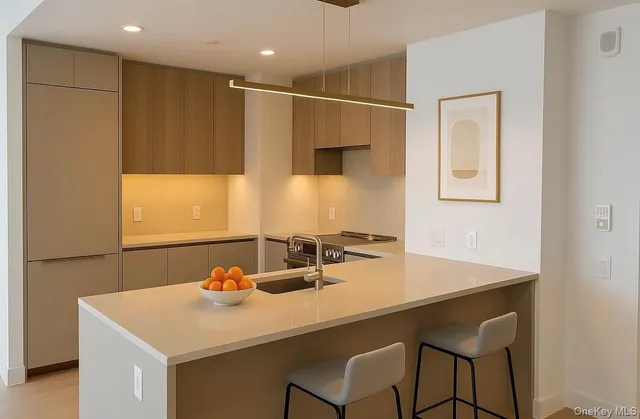 a bathroom with a sink a table and chairs