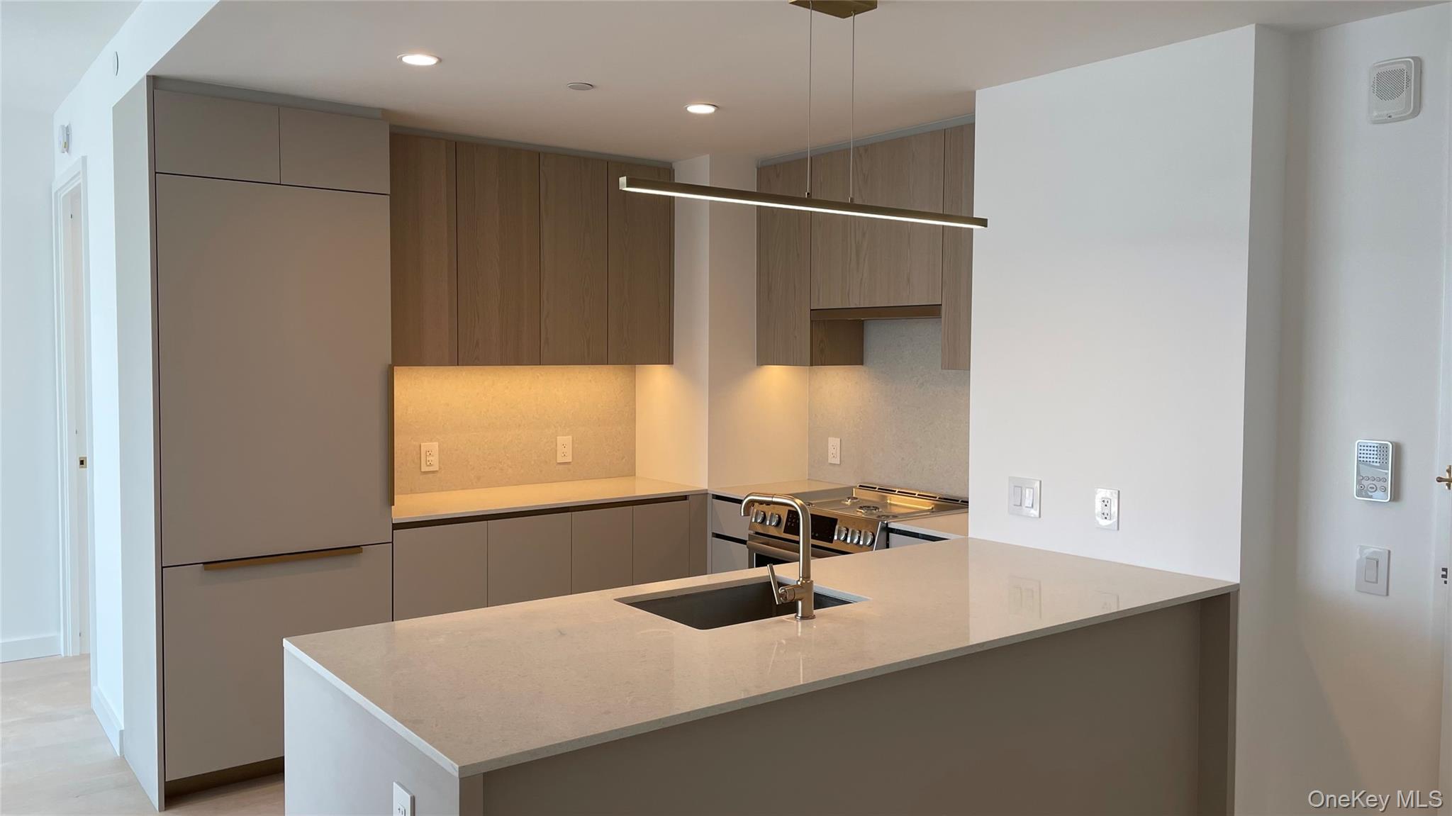 3 Court Square, Unit 5211 Queens, NY 11101 - Photo 6 of 13 a bathroom with a sink and a mirror