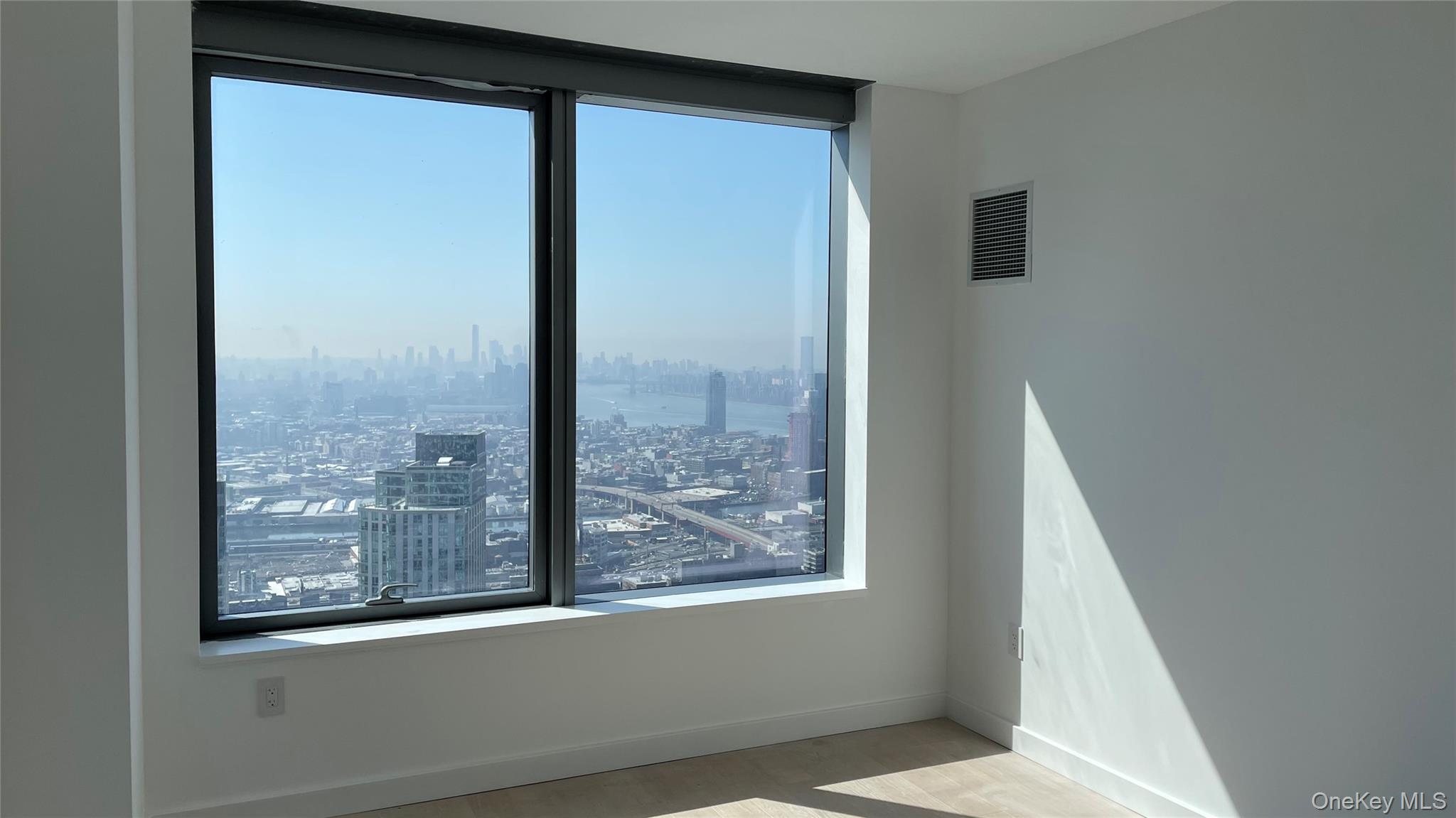 3 Court Square, Unit 5211 Queens, NY 11101 - Photo 7 of 13 a view of a glass door with a window