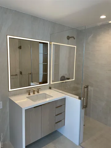 a bathroom with a sink and a mirror