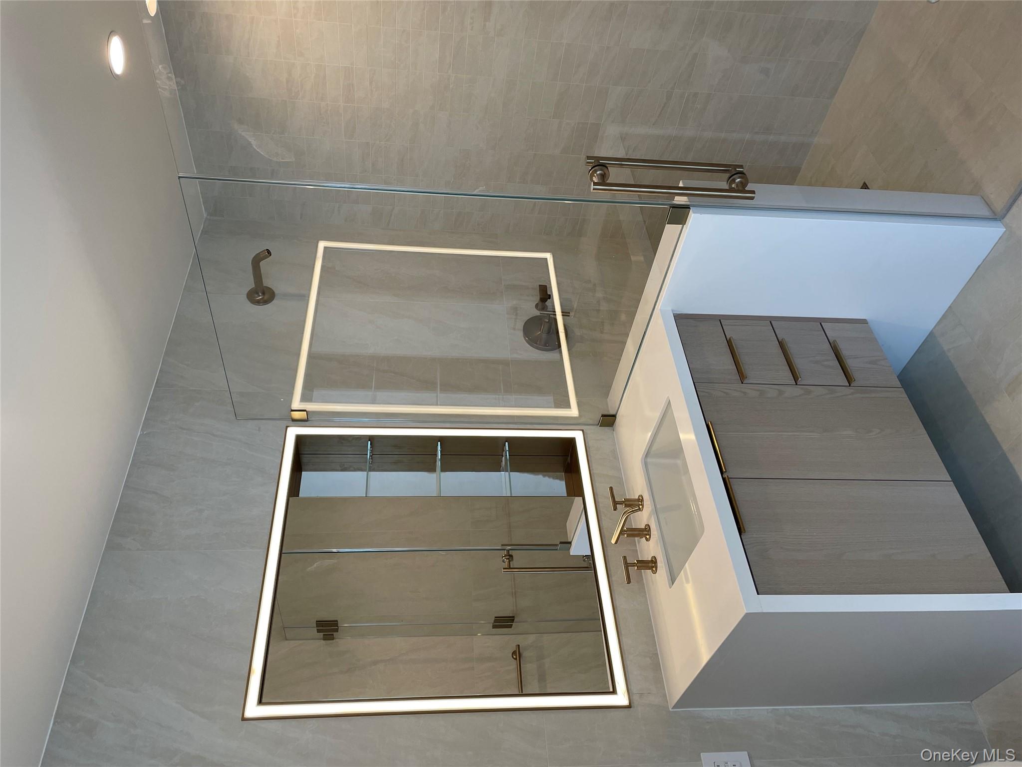 3 Court Square, Unit 5211 Queens, NY 11101 - Photo 9 of 13 a bathroom with a sink and a mirror