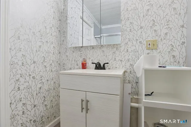 a bathroom with a sink and a shower