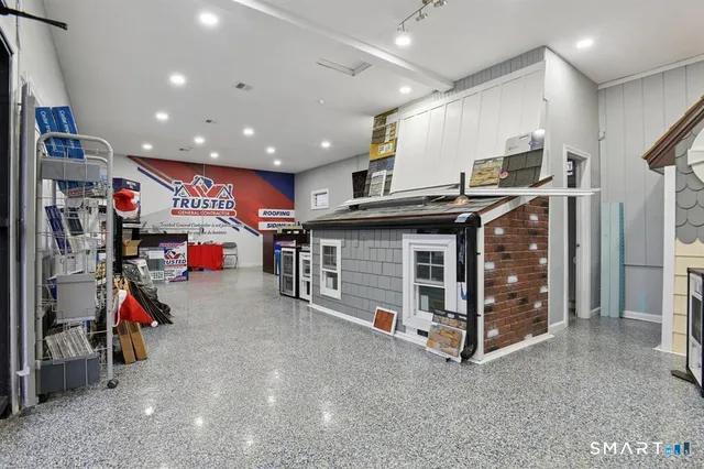 a utility room with dryer and bicycles