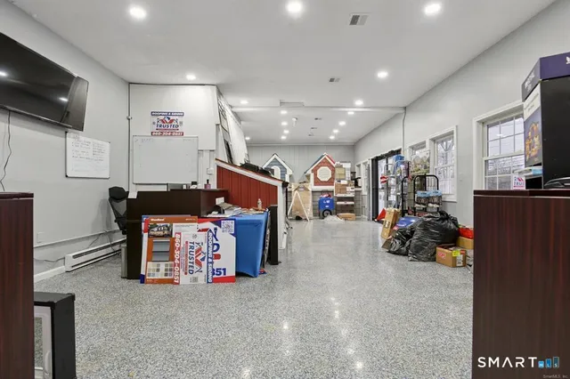 a room with furniture and a flat screen tv