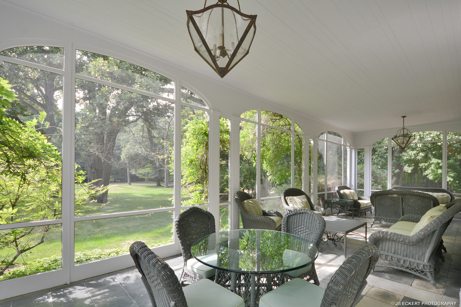 1035 North Sheridan Road Lake Forest, IL 60045 - Photo 12 of 47 a living room with patio furniture and a floor to ceiling window