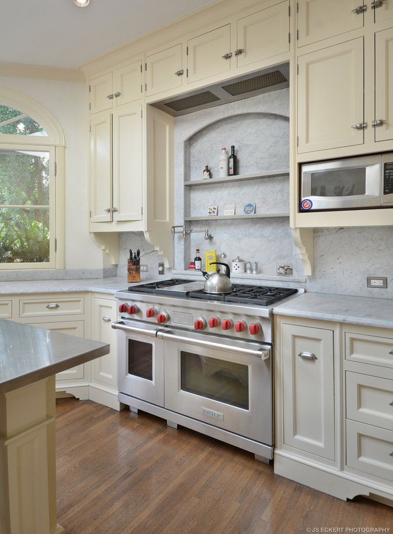 1035 North Sheridan Road Lake Forest, IL 60045 - Photo 19 of 47 a kitchen with stainless steel appliances granite countertop a stove and white cabinets