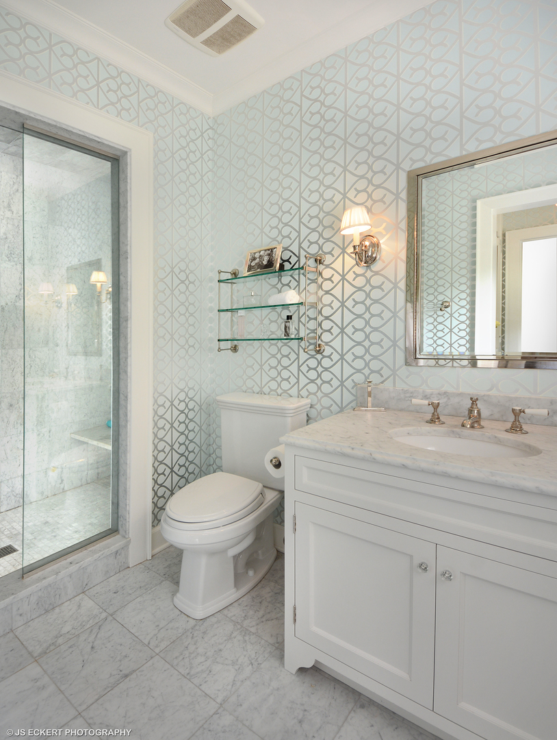 1035 North Sheridan Road Lake Forest, IL 60045 - Photo 32 of 47 a bathroom with a granite countertop toilet sink and mirror