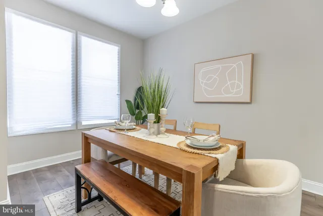 a view of a dining room with furniture and window