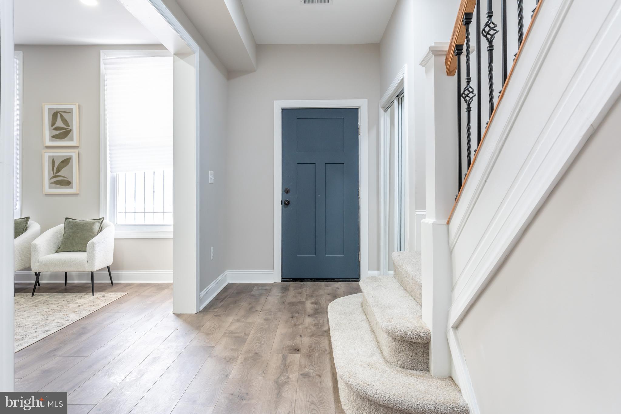 3651 Cottage Avenue Baltimore, MD 21215 - Photo 16 of 38 a living room with furniture and a rug