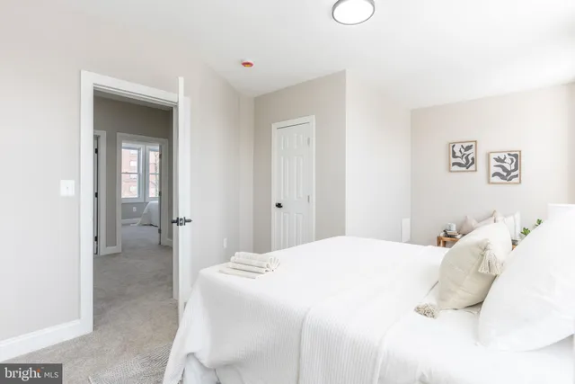 a bedroom with a bed and closet