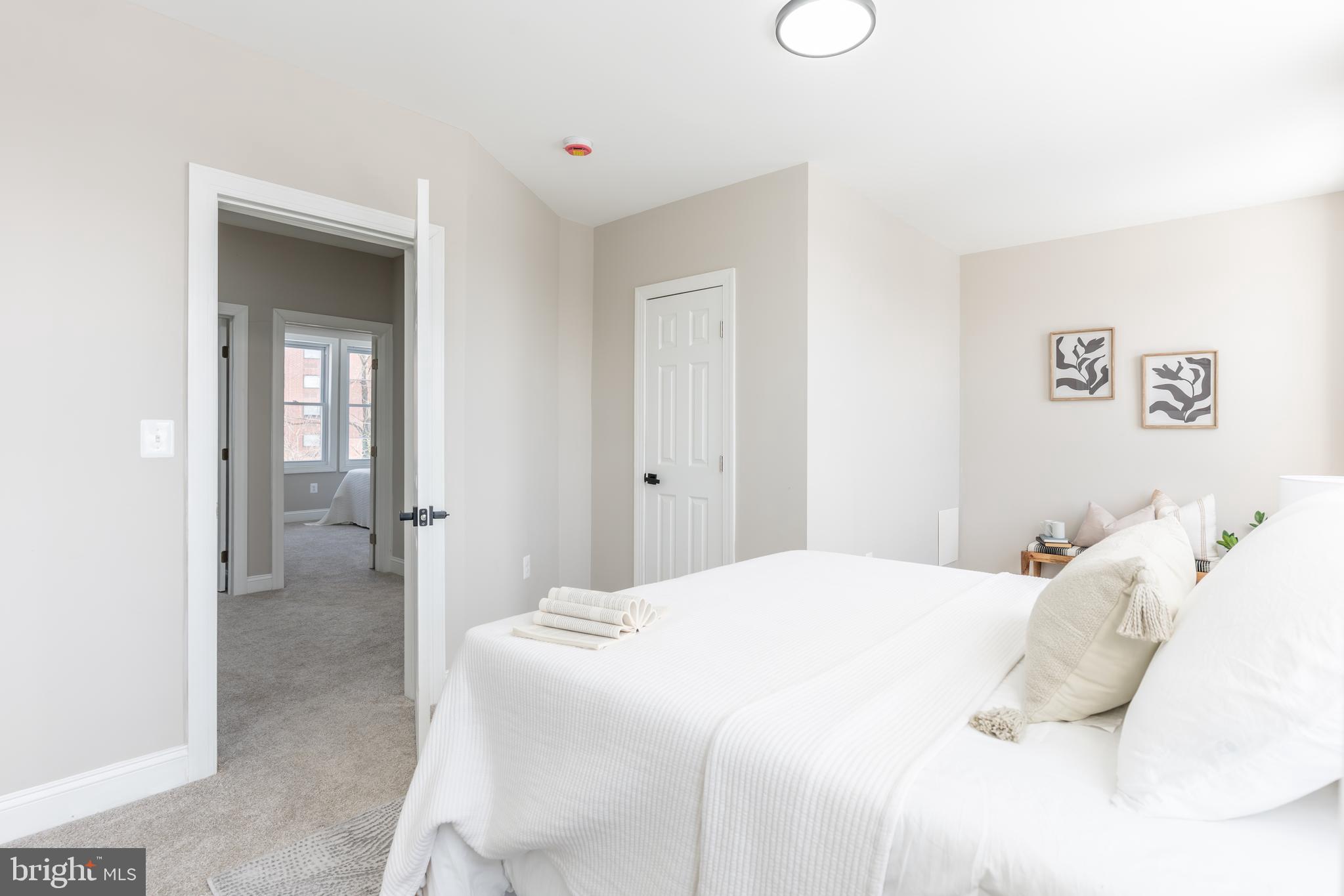 3651 Cottage Avenue Baltimore, MD 21215 - Photo 24 of 38 a bedroom with a bed and closet